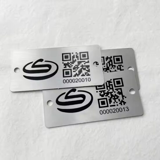 Custom black metal tag with laser-engraved QR code