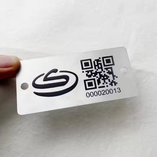 Custom black metal tag with laser-engraved QR code