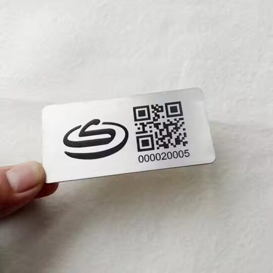 Custom black metal tag with laser-engraved QR code