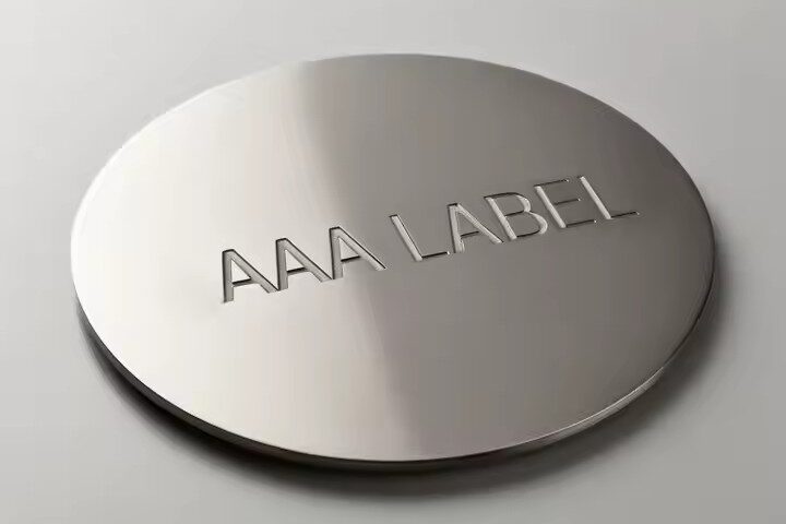 Custom brushed stainless steel nameplate with premium logo design