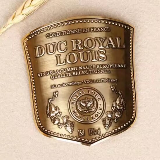 Embossed curved metal wine label with custom logo