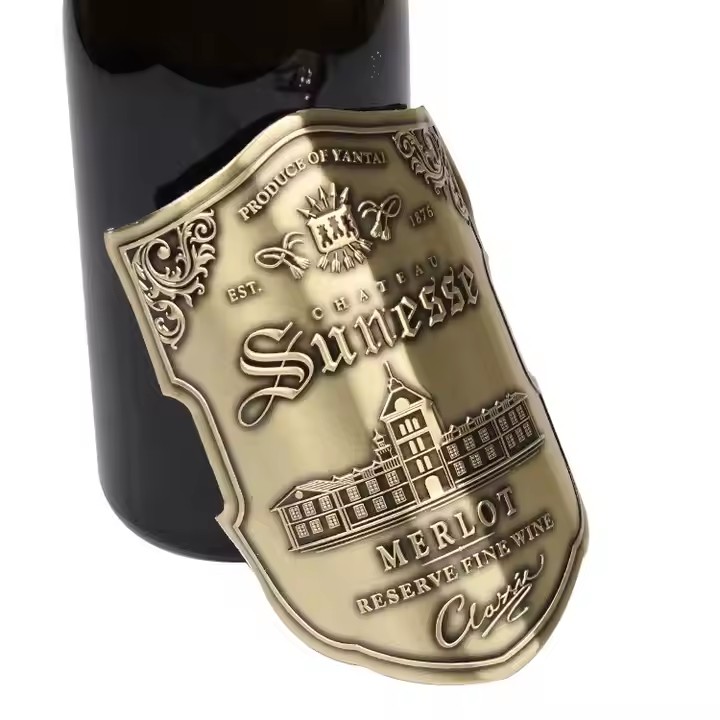 Custom embossed aluminum wine label with adhesive backing
